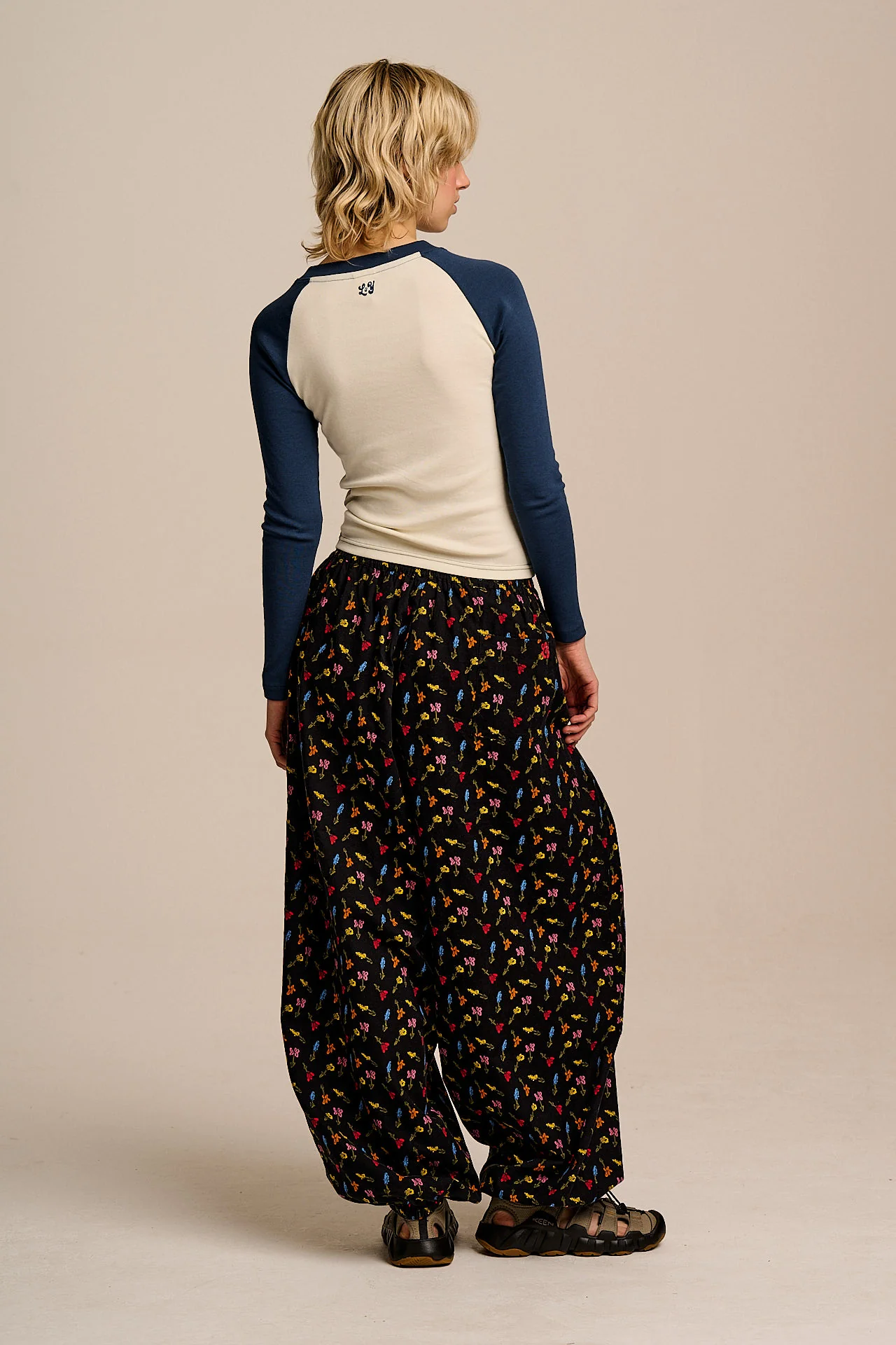 Renata - Cuffed Cotton Balloon Leg Trousers in Mini Tulips on Black - Image 6